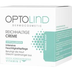 Weiße Creme-Verpackung mit grauem und grünem Text über Feuchtigkeitspflege für sensible Haut.